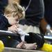 Seven-month-old Michigan fan Cass Yoder, of Detroit, chews on a towel from his sideline seat as Michigan beat Notre Dame 35-31 during the first-ever night game at Michigan Stadium on Saturday. Michigan beat . Melanie Maxwell I AnnArbor.com
